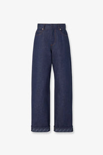 Fendi women’s blue denim jeans with dark blue wide-leg cut and rolled cuffs featuring repeating ff logo pattern