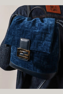 Fendi women’s deep blue velvet backpack with repeating logo pattern black leather trim and gold-tone clasp