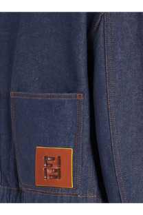 A fendi women’s denim jacket blue with a brown leather patch and raised fendi logo stitched on the front pocket