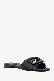 Fendi women’s black leather slide sandal featuring a prominent logo buckle for stylish casual wear