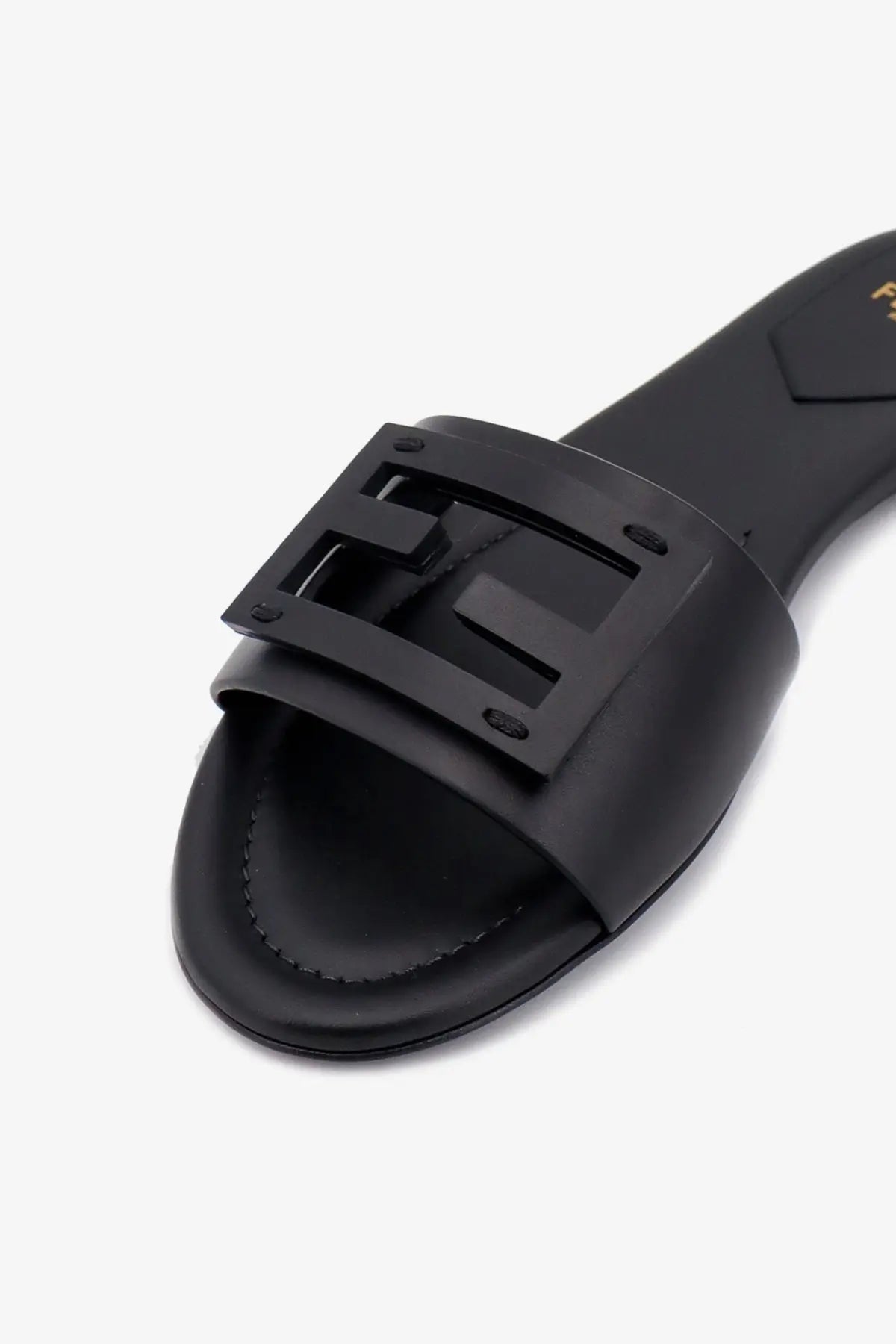 Black leather fendi women’s slide sandal with prominent logo buckle ideal for casual wear
