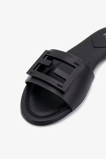 Black leather fendi women’s slide sandal with prominent logo buckle ideal for casual wear