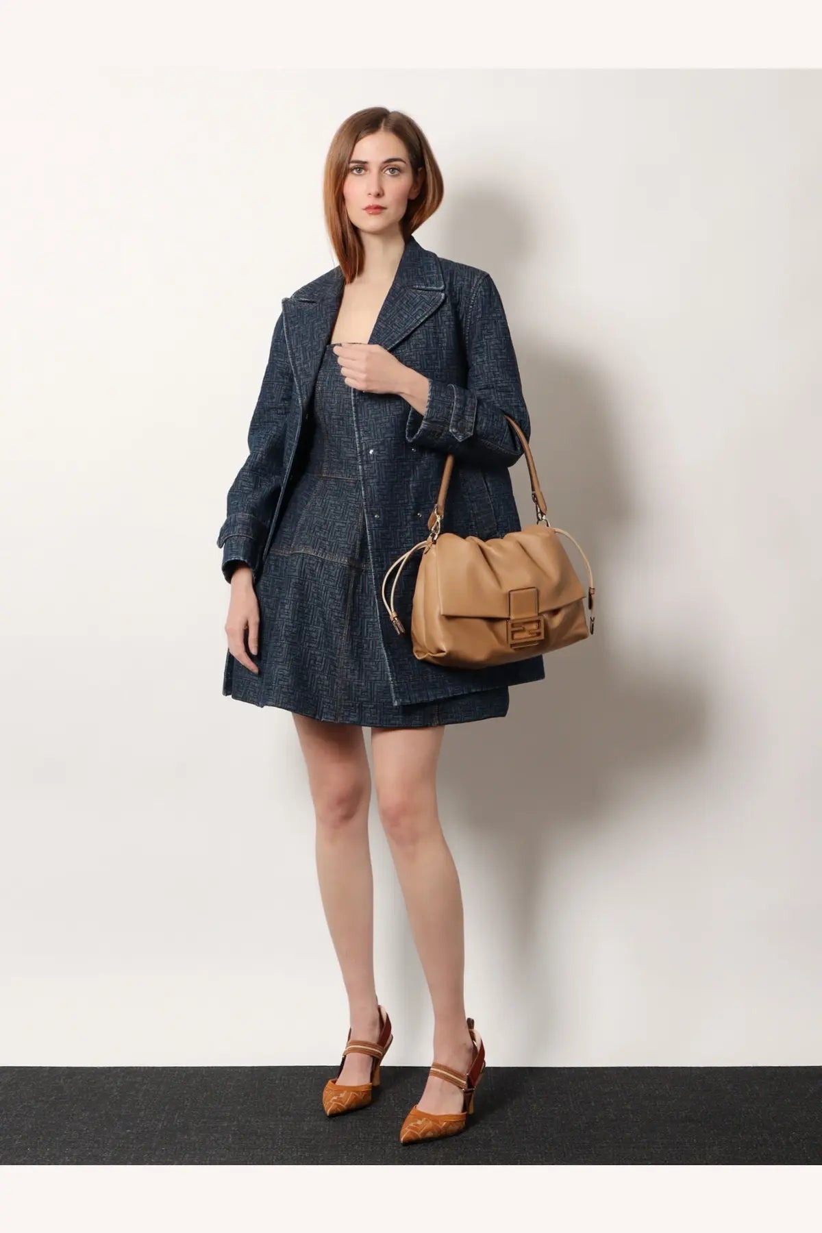 Fendi womens mamma baguette large tan leather shoulder bag with structured design and distinctive logo clasp