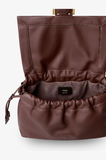 A rich brown leather fendi mamma baguette medium crossbody bag with structured flap and drawstring closure