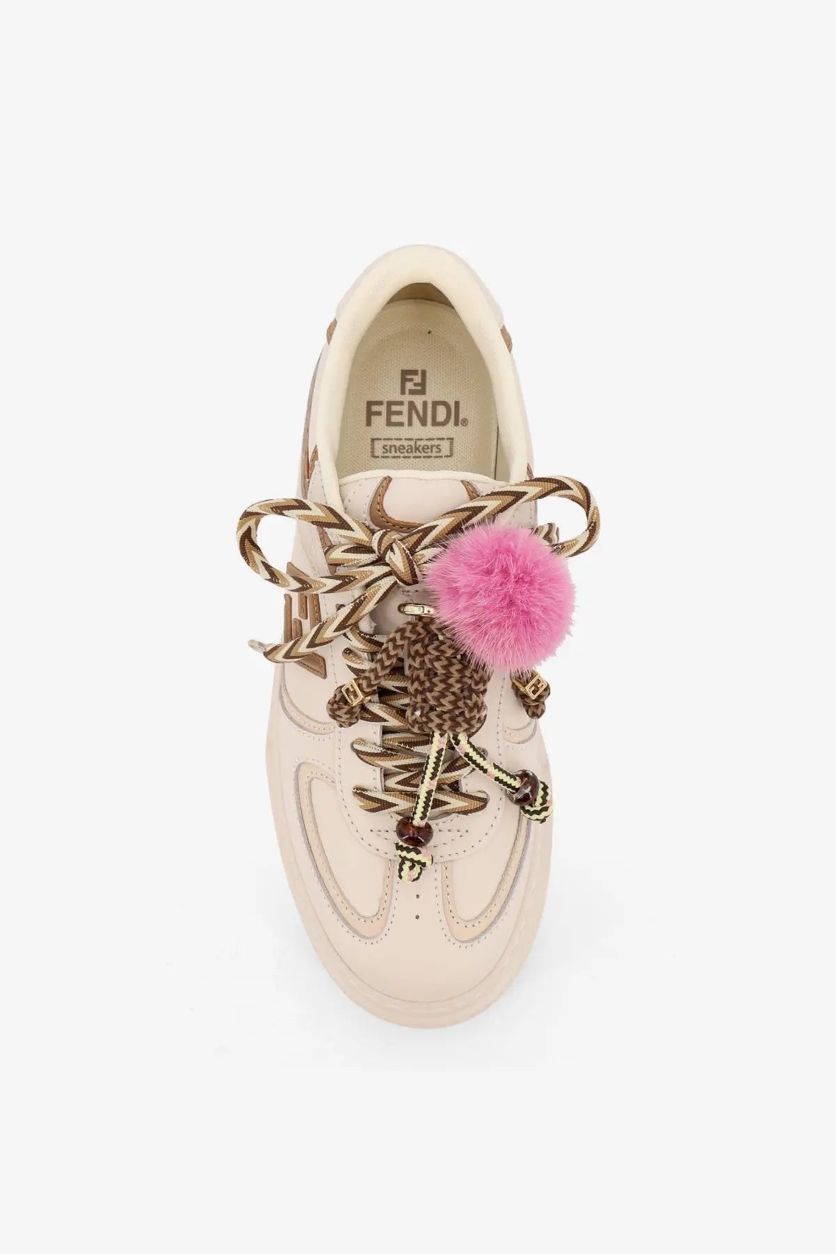 Cream-colored Fendi women’s leather platform sneaker with braided gold-tone laces and pink pom-pom accent
