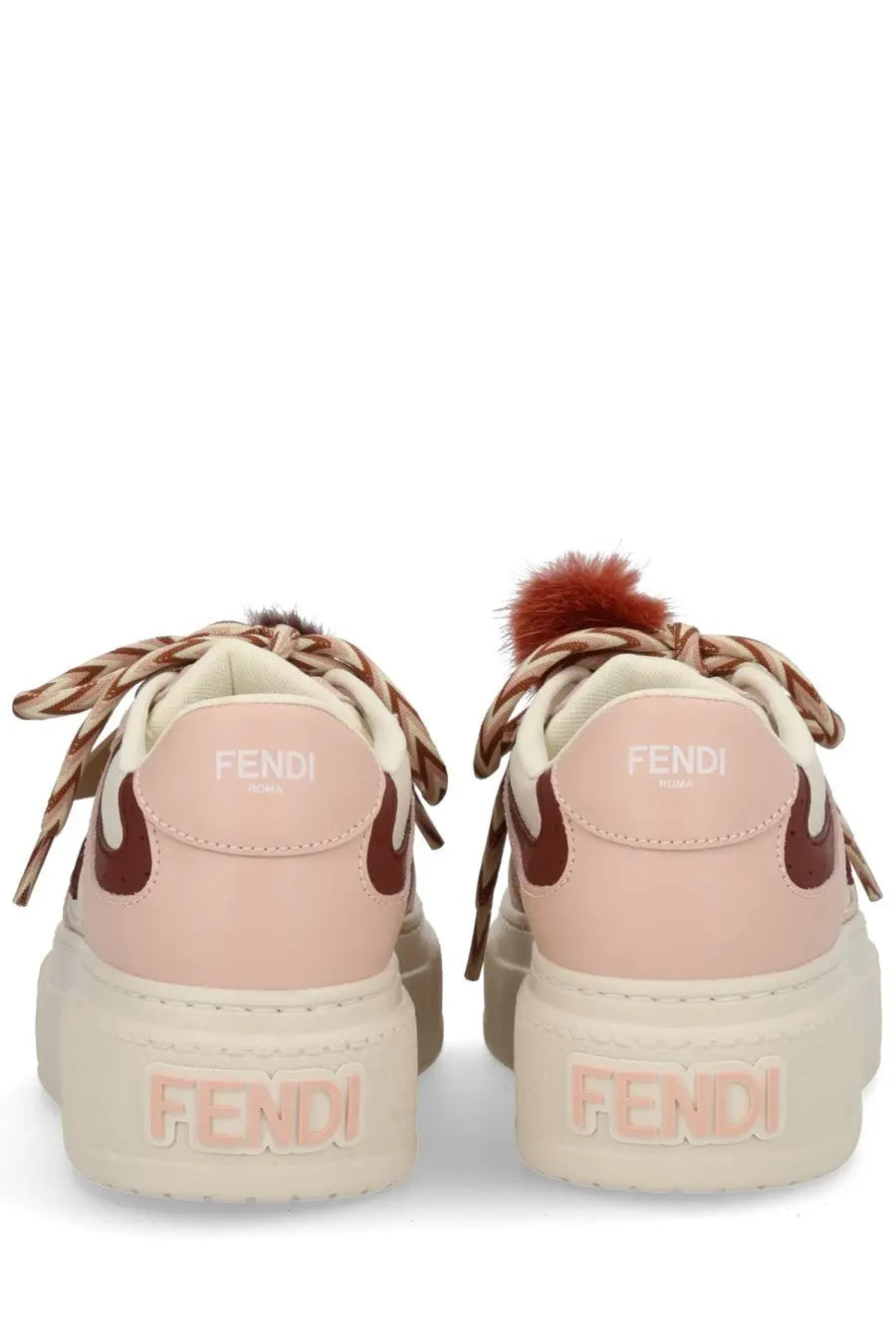 Fendi women’s beige match sneaker with pink and brown accents braided laces and fluffy heel pom-pom shown from back