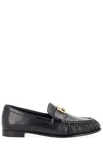 Fendi women’s black leather moccasin baguette loafer with gold-tone buckle and pleated detailing