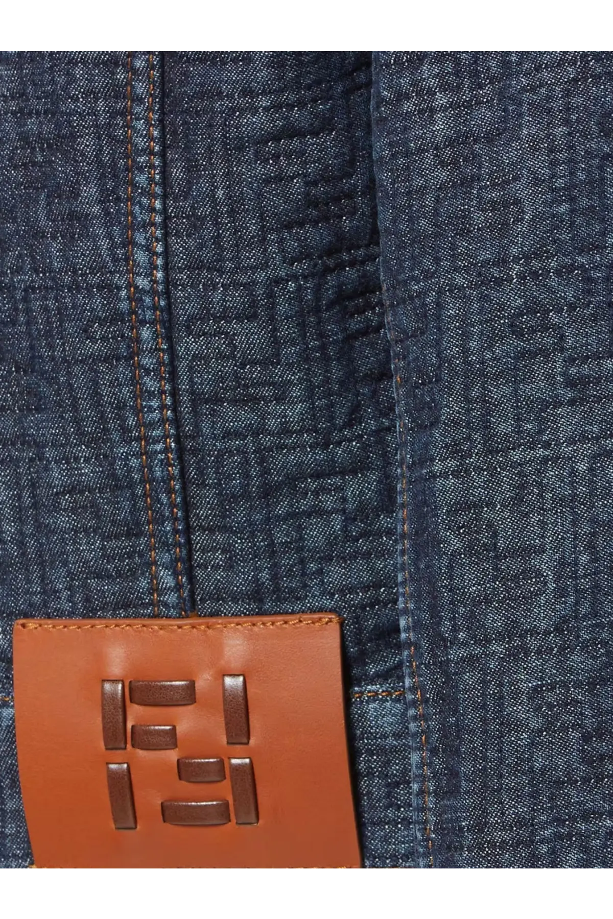 Brown leather patch with embossed fendi logo on dark blue denim fabric of fendi womens padded denim jacket blue