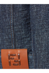 Brown leather patch with embossed fendi logo on dark blue denim fabric of fendi womens padded denim jacket blue