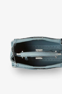 Fendi women’s peekaboo mini crossbody bag in light blue suede with structured rectangular shape and silver hardware