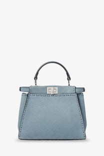 Fendi women’s peekaboo mini leather crossbody bag in light blue textured leather with silver clasp and black handle