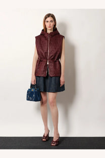 Fendi women’s quilted nylon vest in burgundy with hood, central zipper, and cinched waist for stylish warmth