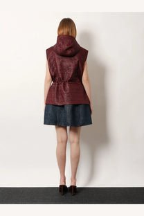 Fendi women’s quilted nylon sleeveless vest in burgundy with hood and cinched waist for stylish layering