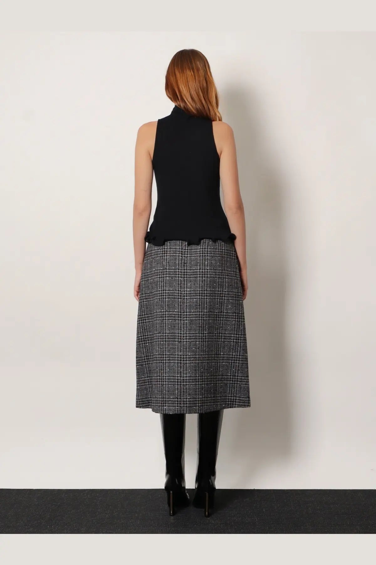 Fendi women’s black ribbed virgin wool sleeveless top with high neckline and ruffled hem front view