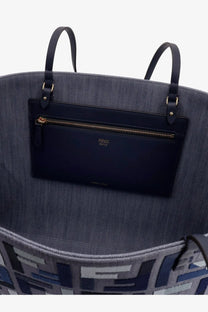 Denim blue Fendi women’s roll large jacquard FF fabric tote bag with black leather handles and front zippered pocket