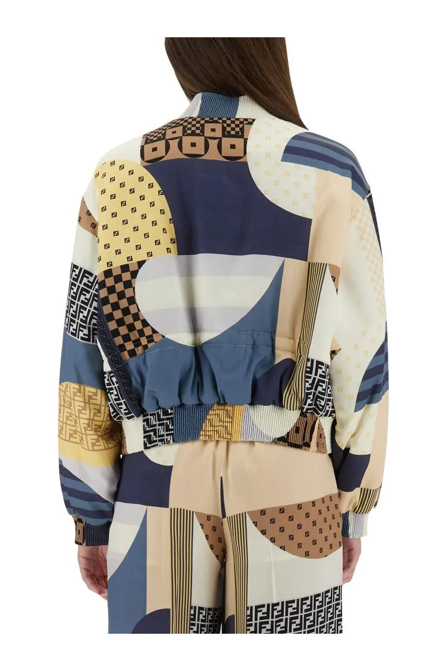 Fendi women’s silk bomber jacket in blue with patchwork bold geometric pattern and repeating logos in navy beige and brown