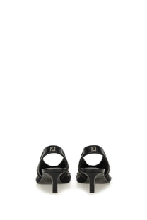 Fendi women’s slingback black mules with a sleek glossy finish and subtle side embellishments in leather