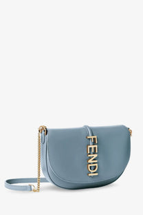 Light blue fendi half-moon leather crossbody bag with gold-tone lettering and chain strap for women