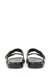 Ferragamo men’s black leather slide sandals with chunky sole and dual-strap design