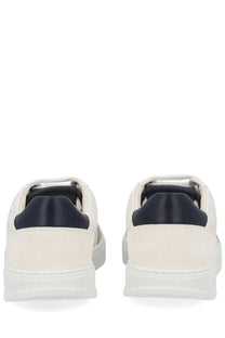 Ferragamo men’s gancini white leather sneakers with navy blue rubber heel tabs and chunky white sole back view