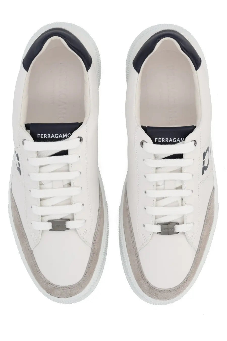Ferragamo men’s gancini white leather sneakers with navy blue accents and silver metal eyelet detail on the tongue