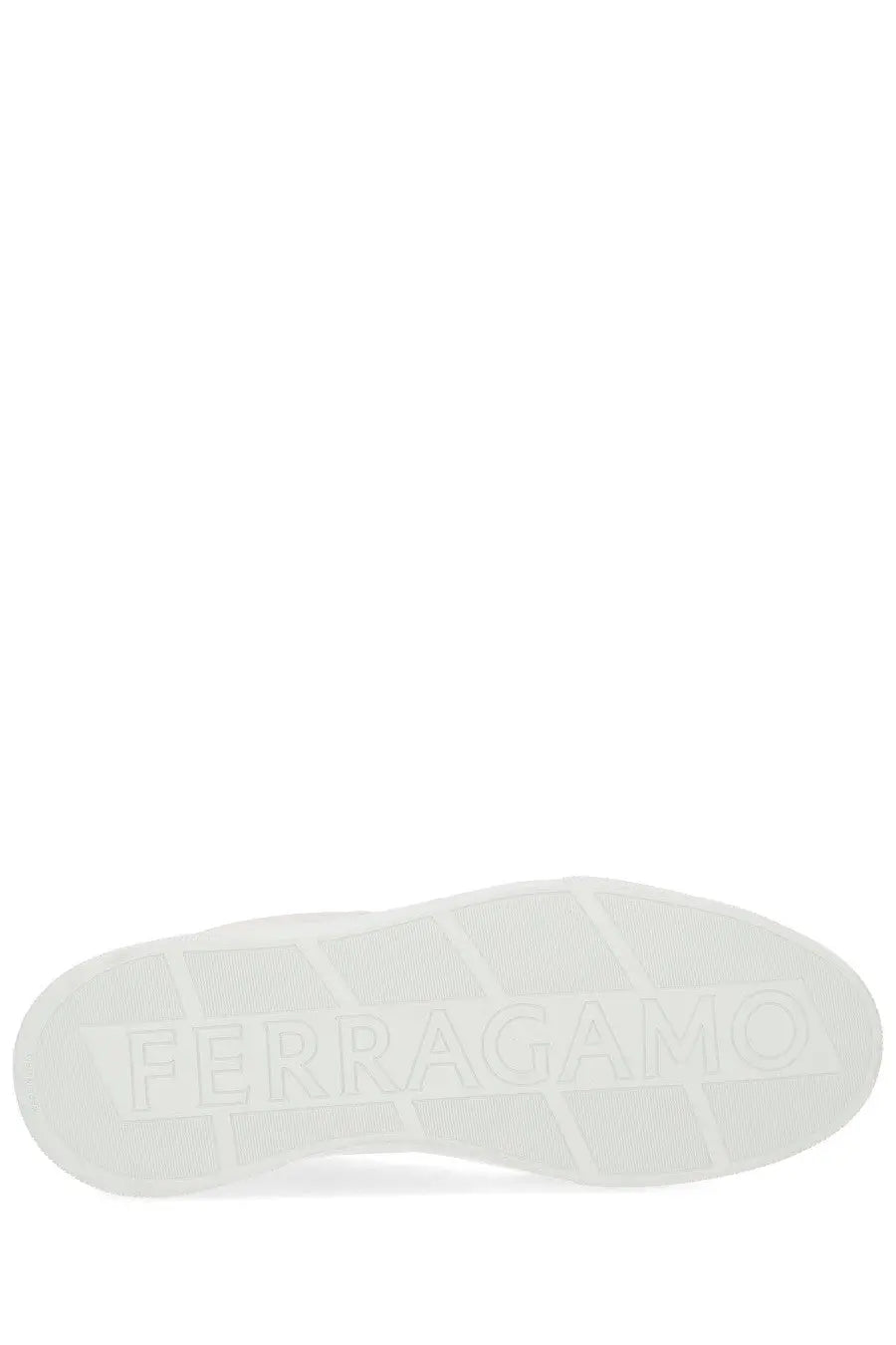 White rubber sole with embossed ferragamo logo on black ferragamo men’s gancini sneaker back side