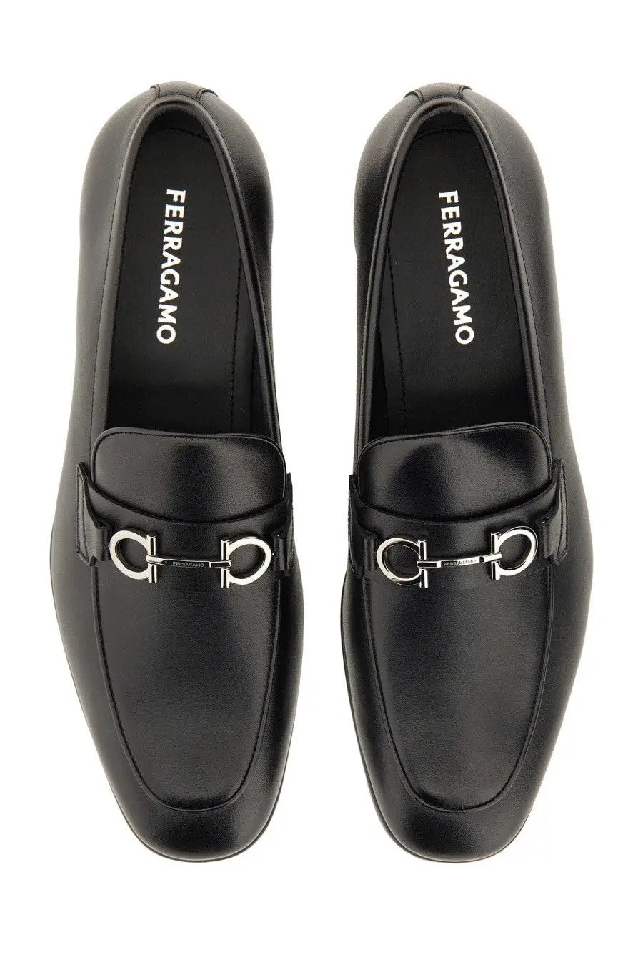 Ferragamo men’s moccasin gancini black leather loafers with silver horsebit buckle and ferragamo logo on the insole