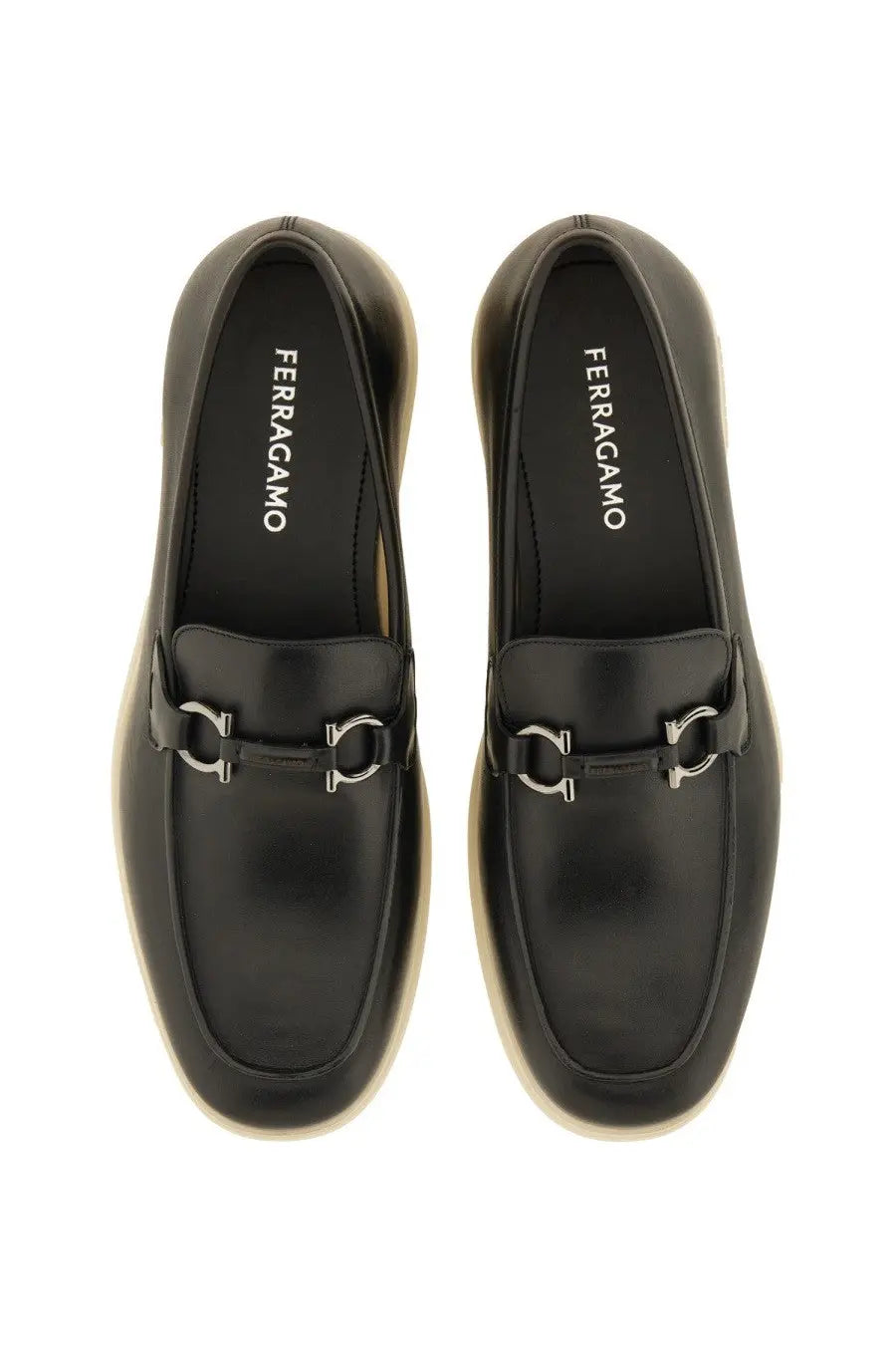 Ferragamo men’s moccasin gancini black leather loafers with silver horsebit buckle and cream soles featuring ferragamo insole