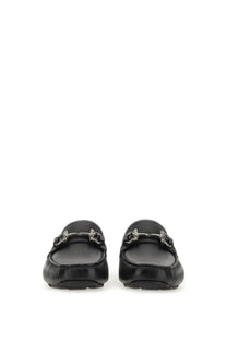 Black leather loafers with silver toned horsebit buckle ferragamo men’s moccasin gancini black front view