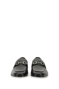 Ferragamo men’s moccasin gancini black patent leather loafers with signature silver horsebit buckle visible front side