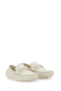Cream-colored Ferragamo men’s moccasin with braided leather detailing and signature double g buckle loafers