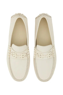 Cream-colored ferragamo men’s moccasin white loafers with smooth leather finish and signature double g buckle detail