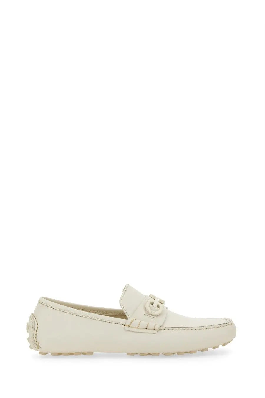 Cream-colored ferragamo men’s leather moccasin loafer with distinctive double-g buckle and frayed detailing