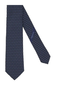 Ferragamo men’s silk tie in dark blue with a repeating light gray horseshoe pattern