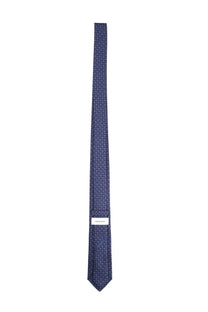 Ferragamo men’s silk tie in navy blue with a subtle geometric pattern and brand label at the base