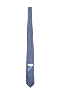 Ferragamo men’s silk tie in navy blue with a subtle geometric pattern and light blue accents