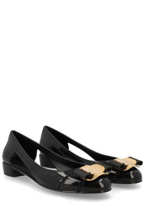 Ferragamo women’s ballerina nara jelly black patent leather flats with gold-tone bow accents