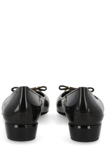 Ferragamo women’s ballerina nara jelly black patent leather ballet flats with glossy finish and gold-tone bow accents