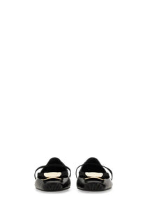 Ferragamo women’s dancer zina black patent leather loafers with gold-tone bow accent front view