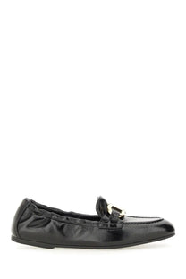 Ferragamo women’s deconstructed loafer black patent leather with gold-tone buckle accent in front view