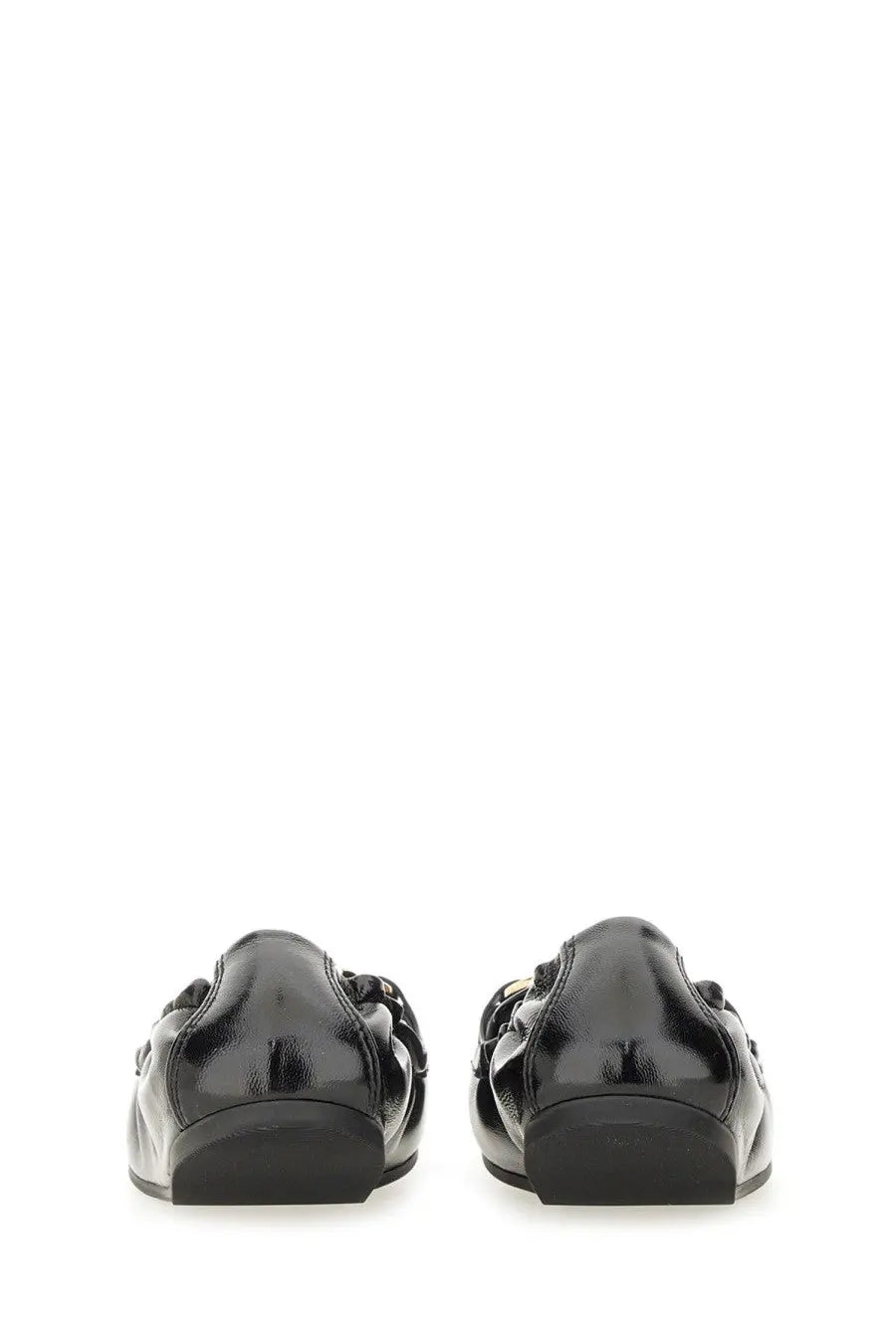 Back view of ferragamo women’s deconstructed loafer black patent leather with glossy finish and chain detailing