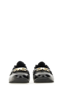 Ferragamo women’s deconstructed black patent leather loafers with gold-tone t-monogram buckles