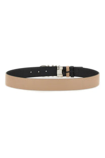 Beige leather Ferragamo women’s Gancini reversible belt with sleek silver-toned buckle and black inner lining