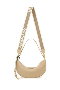 Beige leather crescent-shaped ferragamo crossbody bag with woven branded strap for women use