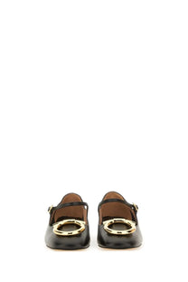 Ferragamo women’s black leather mary jane flats with gold tone circular buckles elegant and versatile shoes