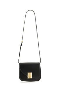 Ferragamo women’s black leather crossbody shoulder bag with gold tone rectangular clasp and matching strap