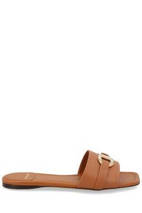 Tan leather slide sandal with gold-tone buckle detail ferragamo women’s slide gancini beige