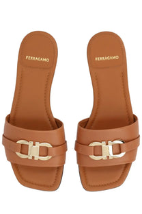 Ferragamo women’s slide gancini beige tan leather sandals with gold-tone metal clasp featuring gancini logo