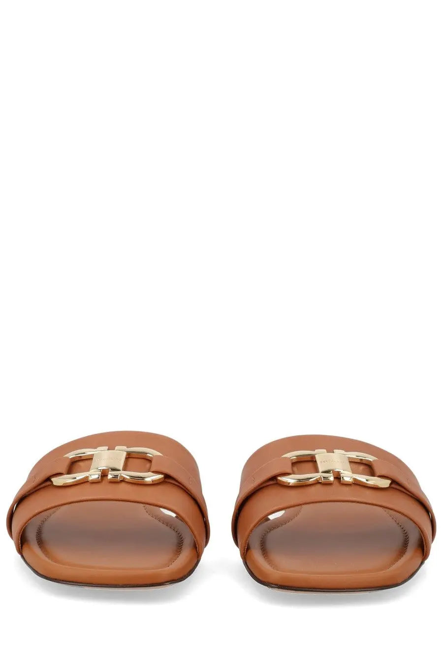 Ferragamo women’s slide sandals in tan leather with a gold-tone gancini buckle in beige