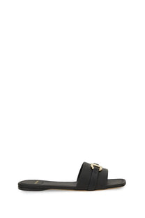 Ferragamo women’s black leather slide sandal with gold tone buckle detail for stylish casual wear